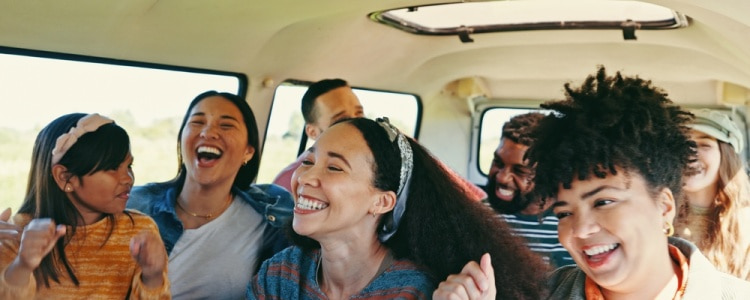 smiling San Francisco passengers on a charter bus